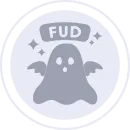 A circle with a grey ghost with wings. Above the ghost is the acronym FUD with two stars on each side