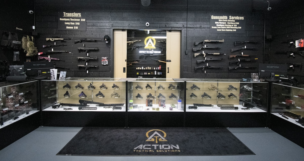firearms on wall and case display in store