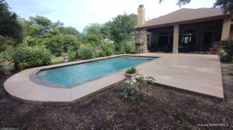 Trowel down overlay 6900PSI Simulated Slate like texture stained semitransparent with a solvent based acrylic sealer, Anti-slip.