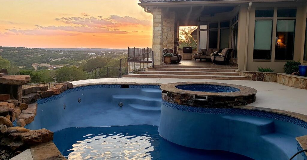 gunite/concrete pool overlooking sunset