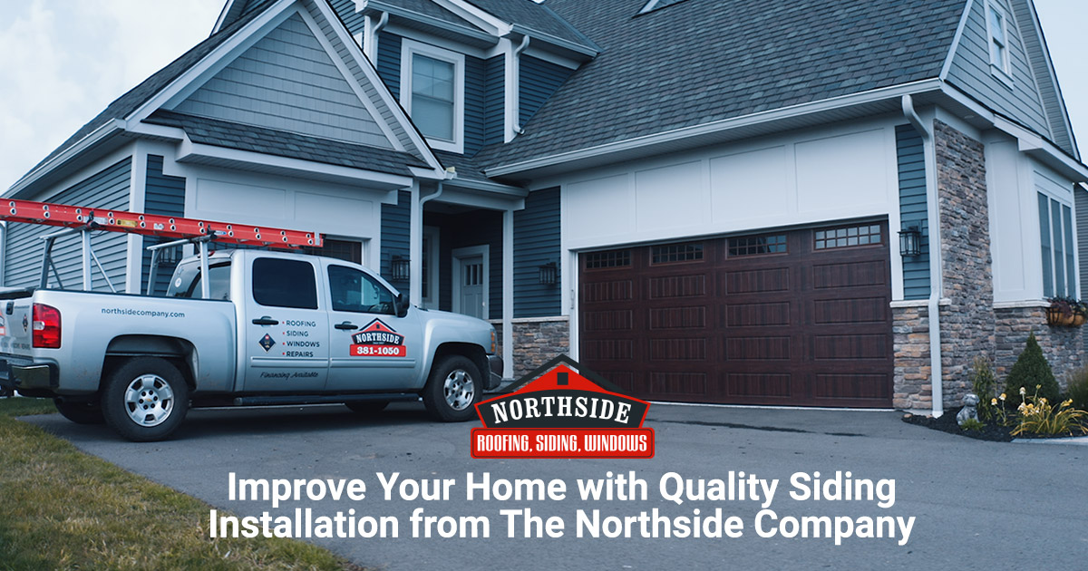 truck with northside logo in front of grey house