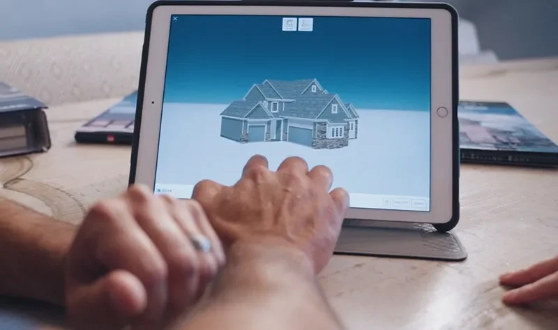 man viewing house with new roof markup on ipad