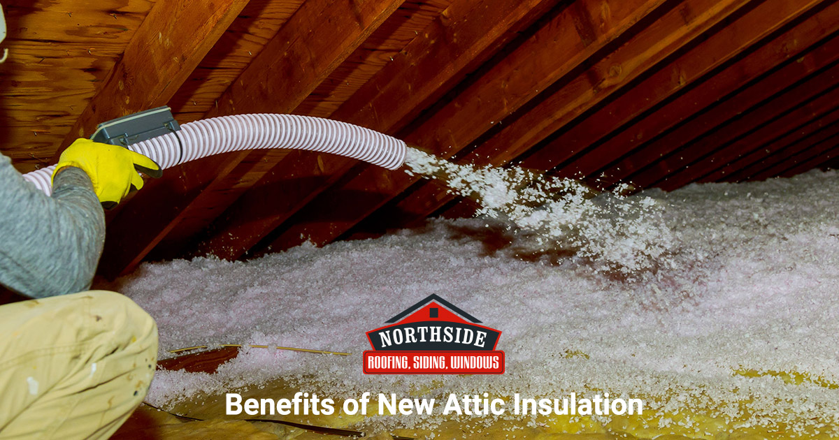 fluffy insulation being pumped into an attic space