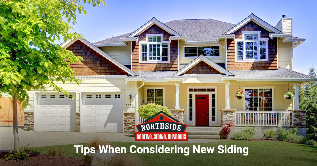 home with wood and yellow siding and stonework