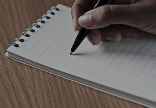 hand writing in a notebook