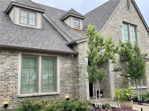 brick house with dormer windows