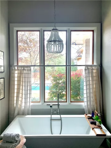 white framed windows on a brick house