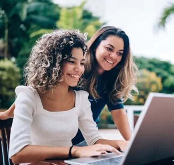 Two women on a laptop