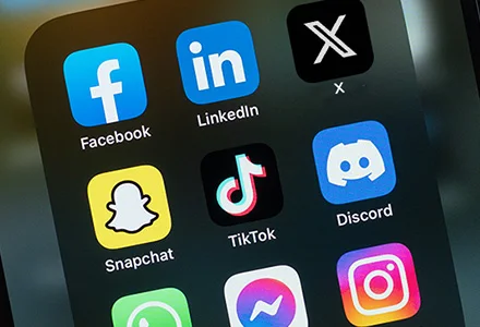 a phone showing social media apps for a marketing agency