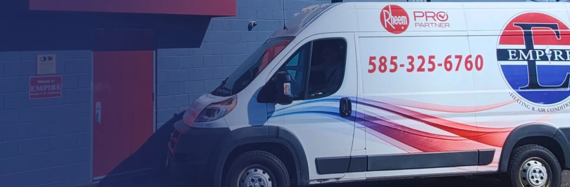 three red and white service vans parked in a driveway