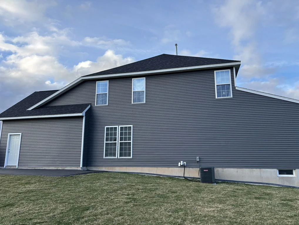 Modern house with dark gray siding