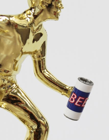 Plaque with Male Cornhole Drinking Figure