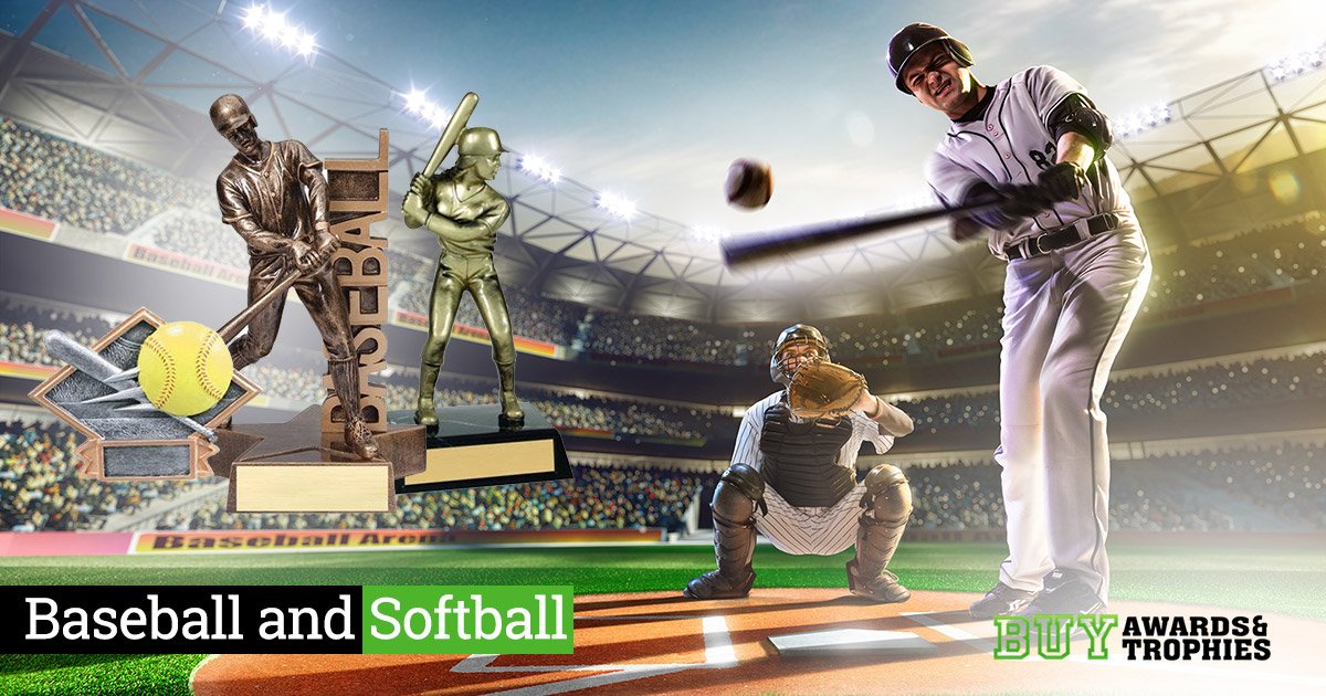 Baseball and softball players in stadium with awards and trophies