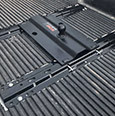truck bed slide rail system with a black hitch lock mechanism