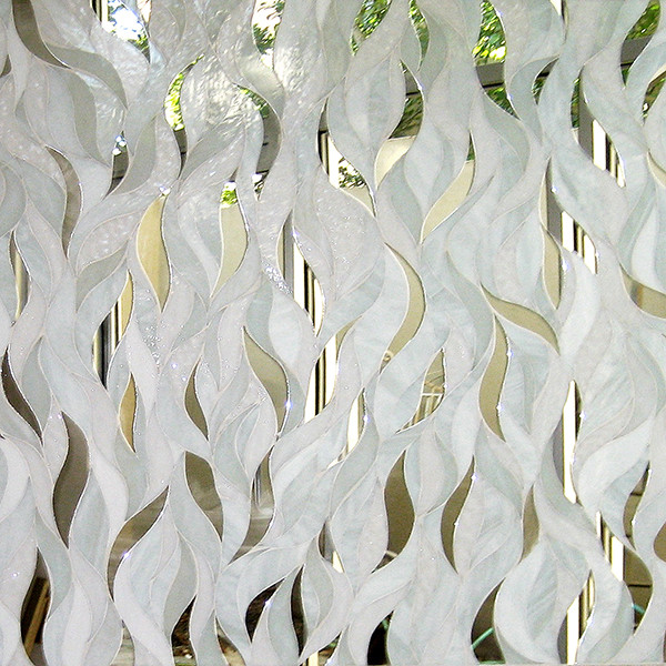 A wavey white glass mosaic pattern.