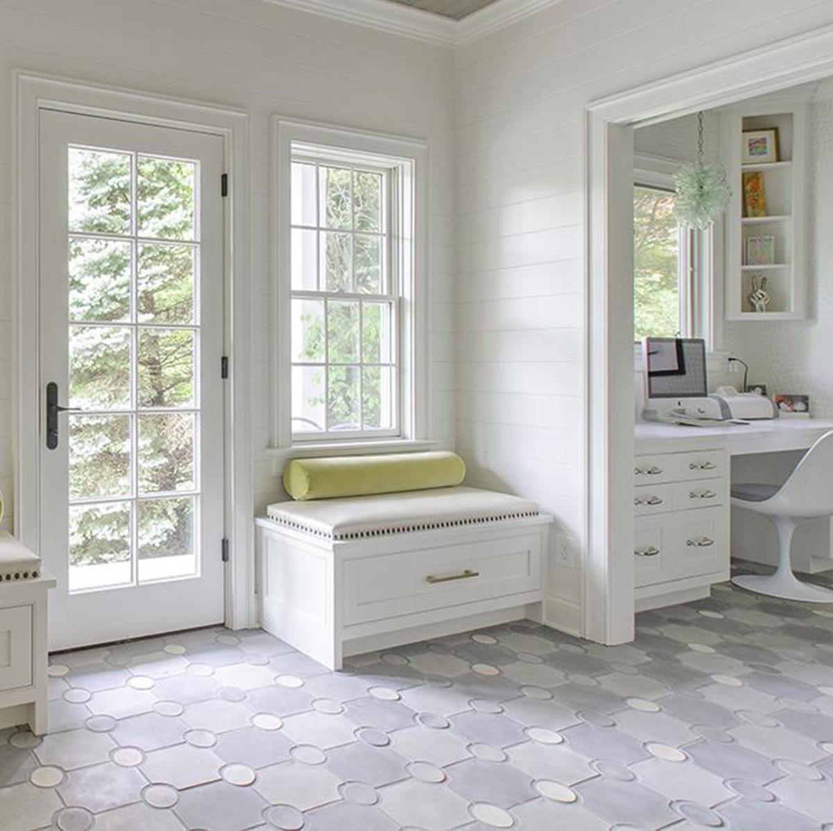Beautiful white office with a desk and chair and large windows