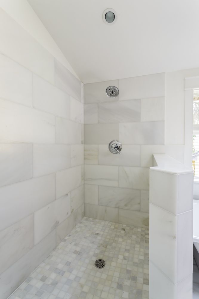 marble square floor tile with rectangle shower wall tiles