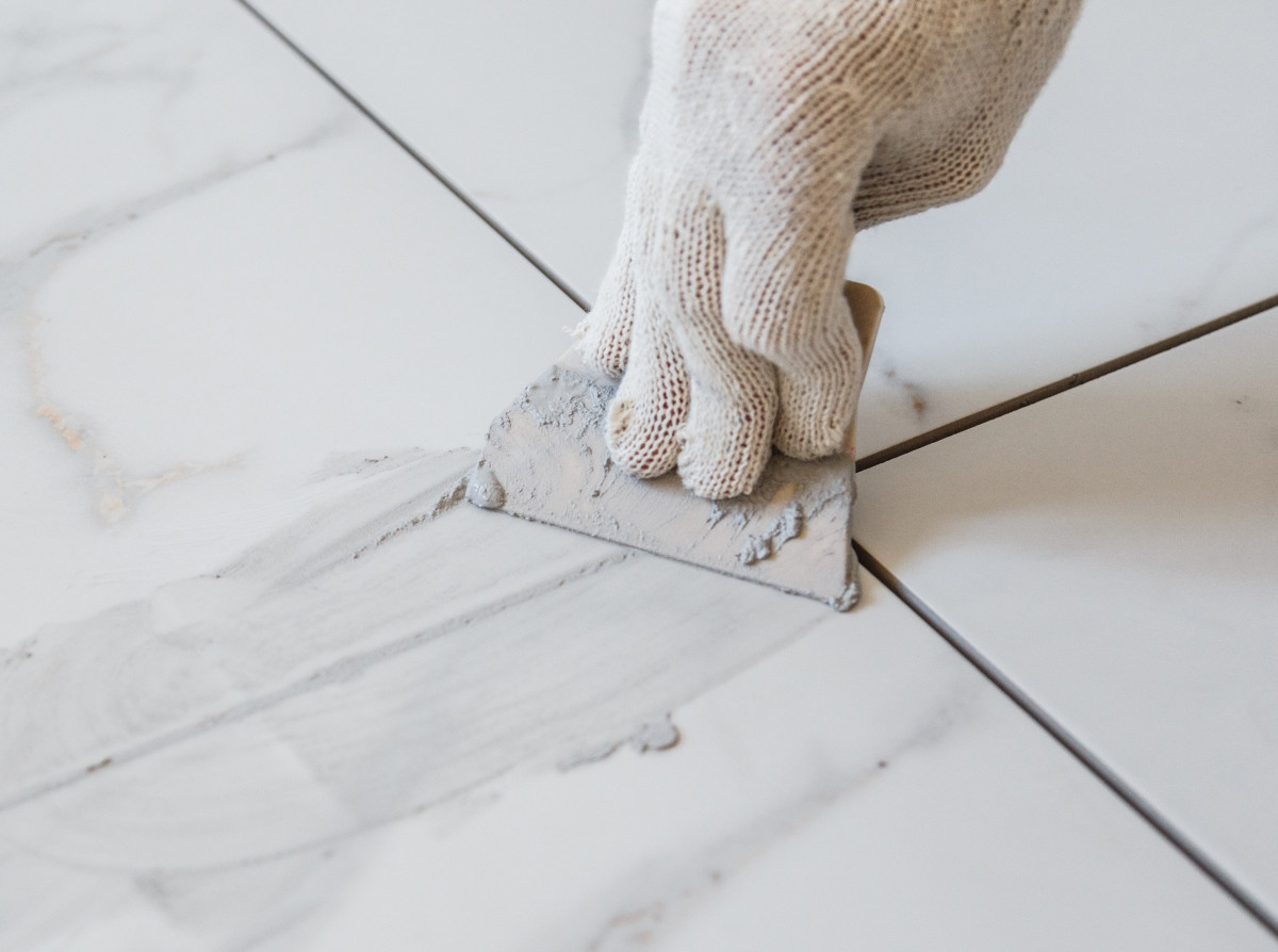 white kitchen with waterfall edge island and black stools