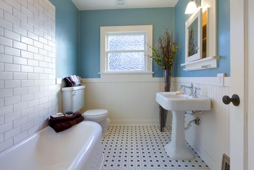 traditional style bathroom tile with blue wall and tub
