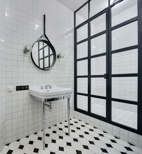 black and white bathroom shower with diamond tile floor