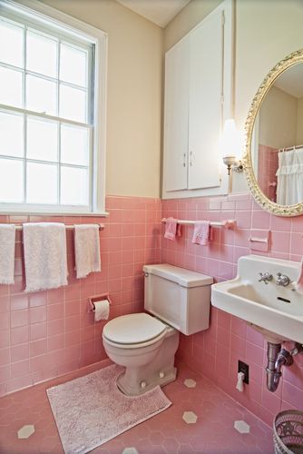 pink tiled bathroom floor and walls