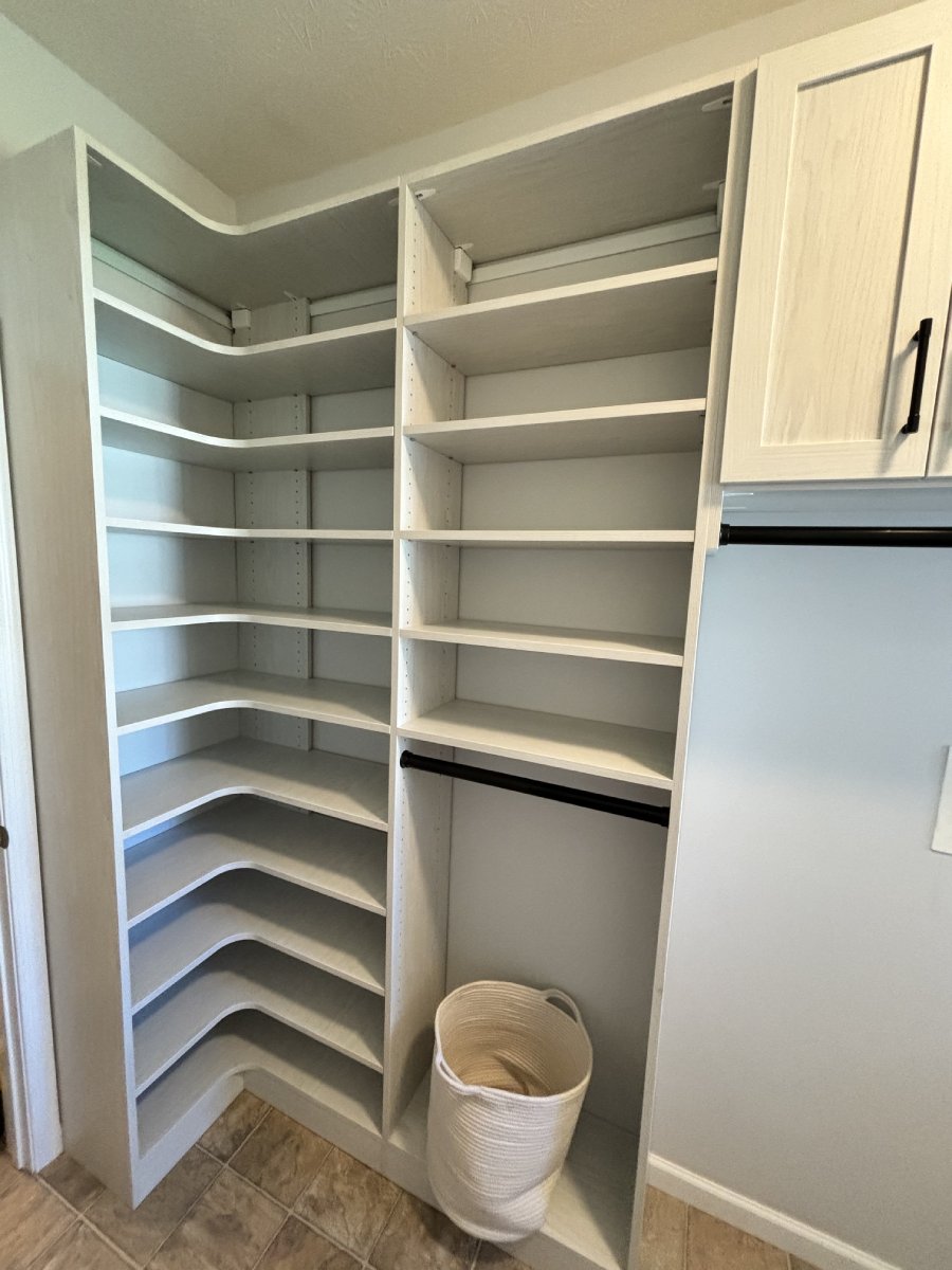A white shelves in a closet