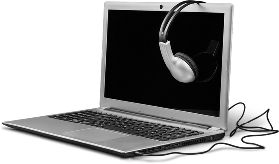 laptop open with headphones hanging on the top