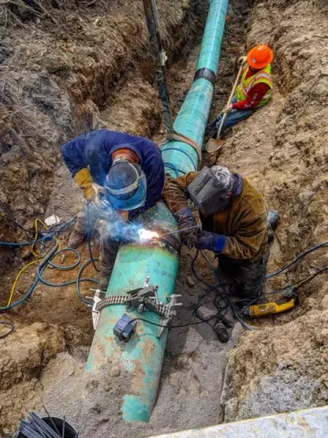 Welding a 16" gas line on Empire Blvd. in Rochester, NY.