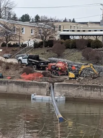 Drill crew installing an 18" drain pipe into the canal in Lyons, NY.