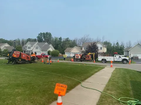 Installing fiber optic for a neighborhood in Greece, NY.