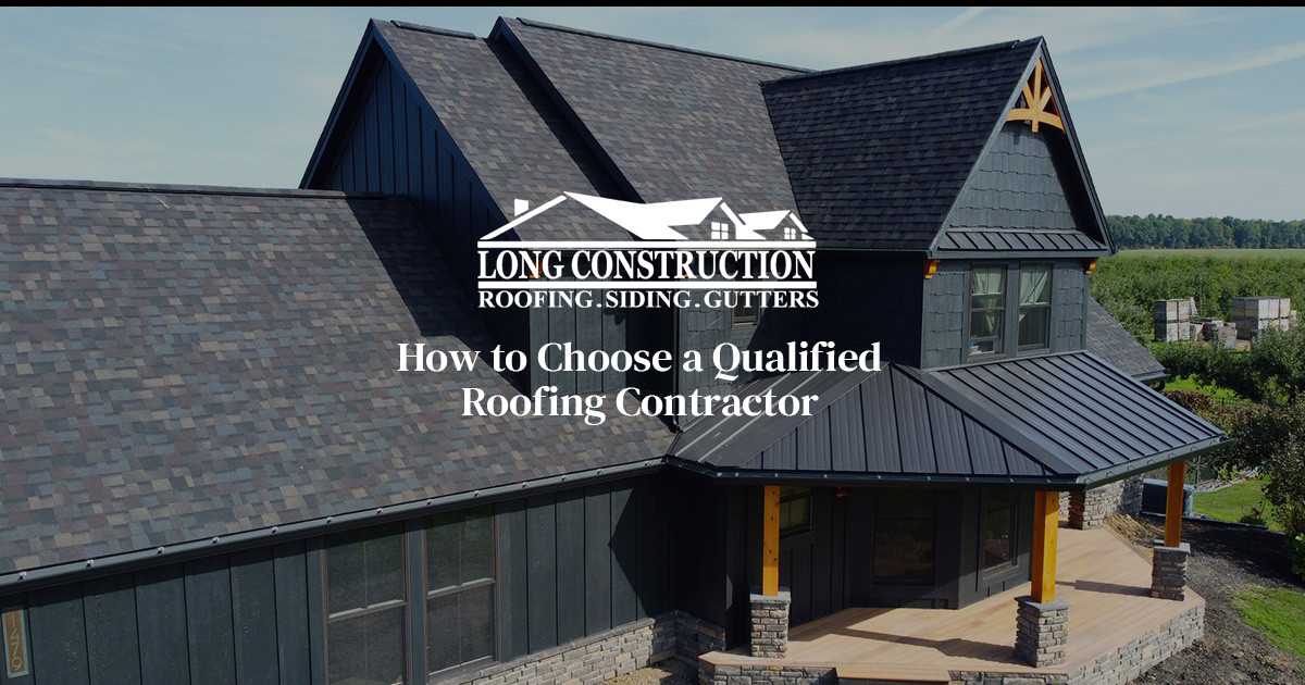 dark colored house with shingle roofing