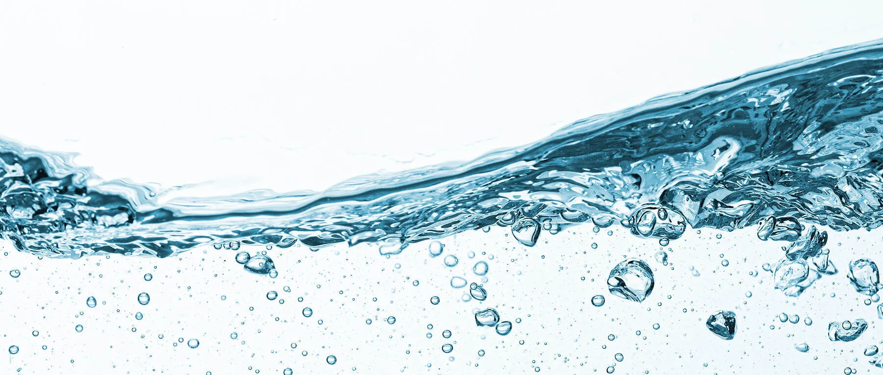 Clear water with bubbles, showing movement and waves against a white background.