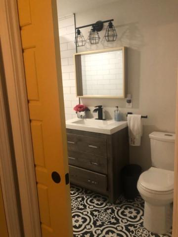 updated bathroom renovation showing sink and toilet