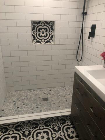 after bathroom renovation with updated shower and tile