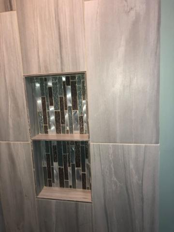 close up of tile work in renovated bathroom