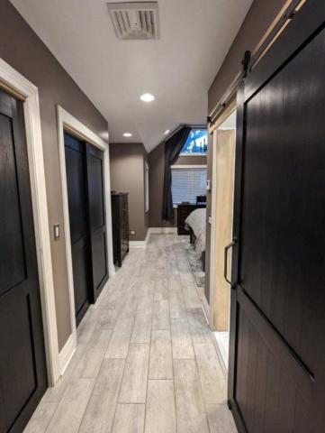 crosman terrance bedroom on top floor renovation view of hallway into bedroom