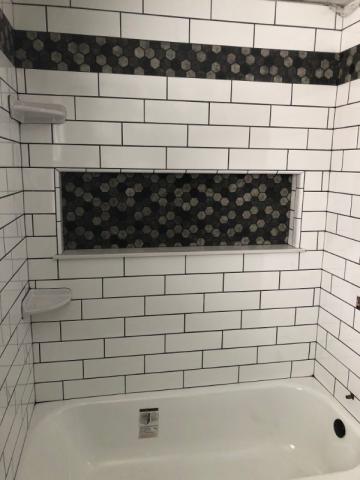 close up of subway tile in tub and shower