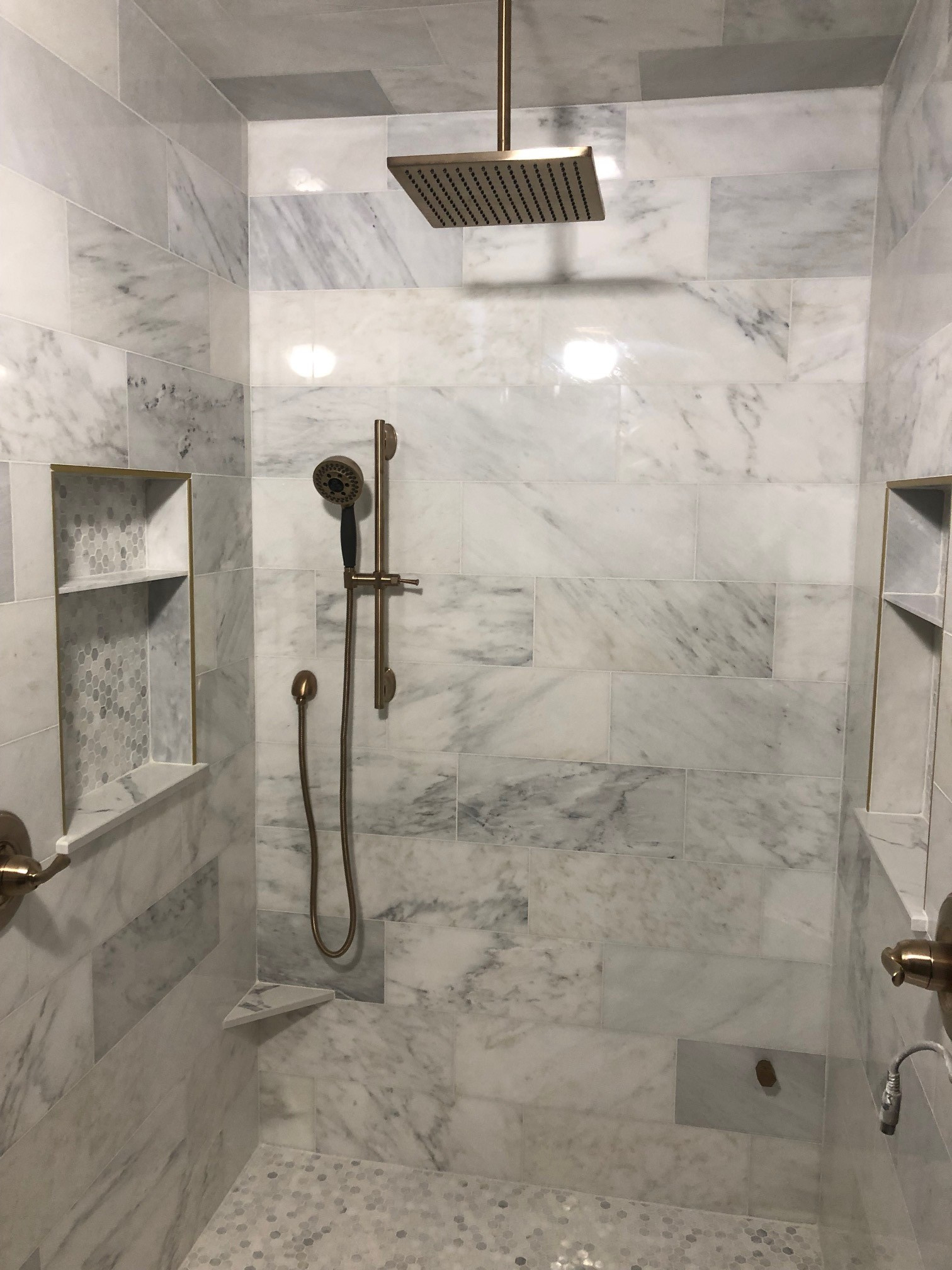 gray marble and tile waterfall shower
