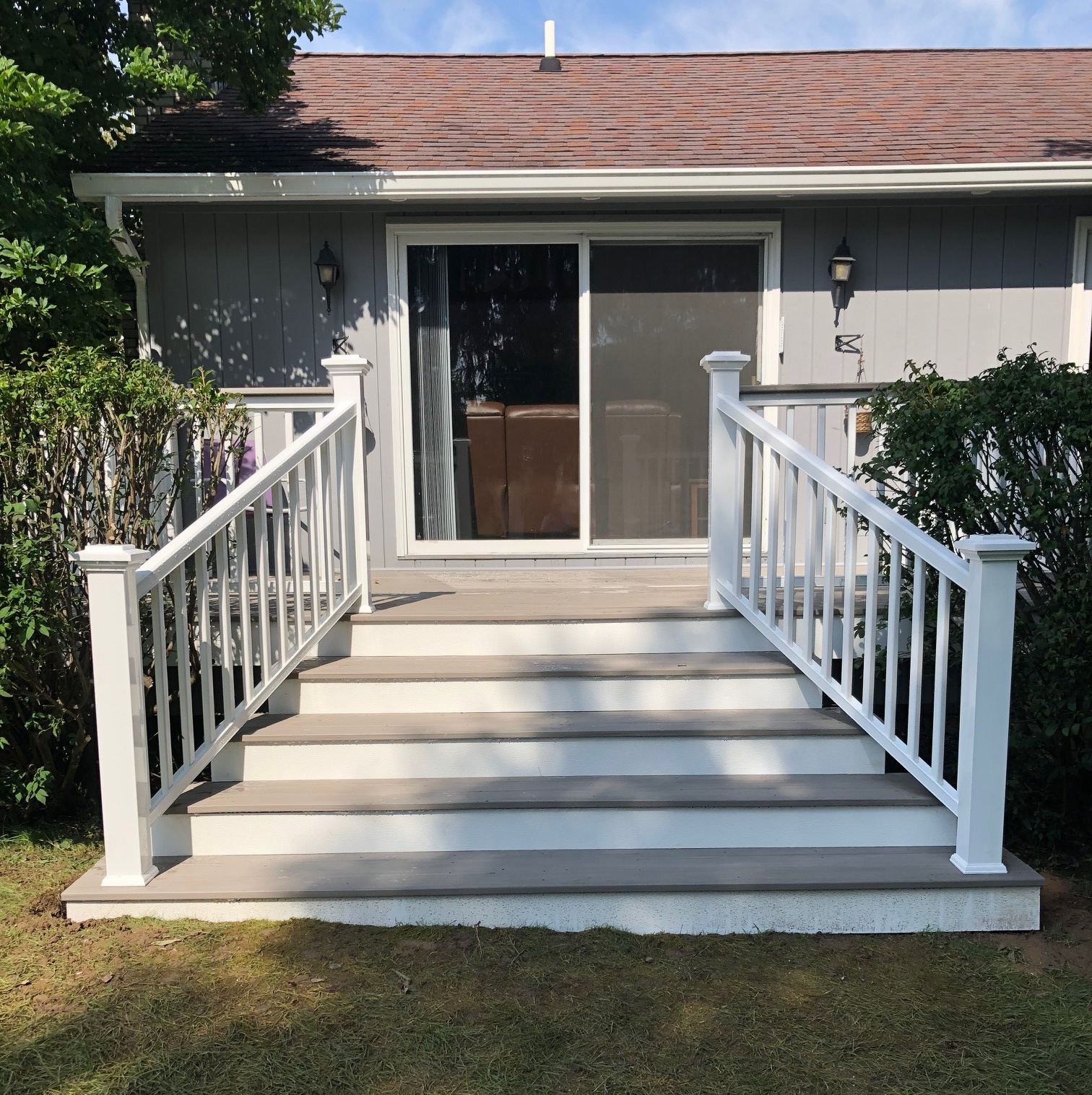 brown and white deck with large sliding glass door