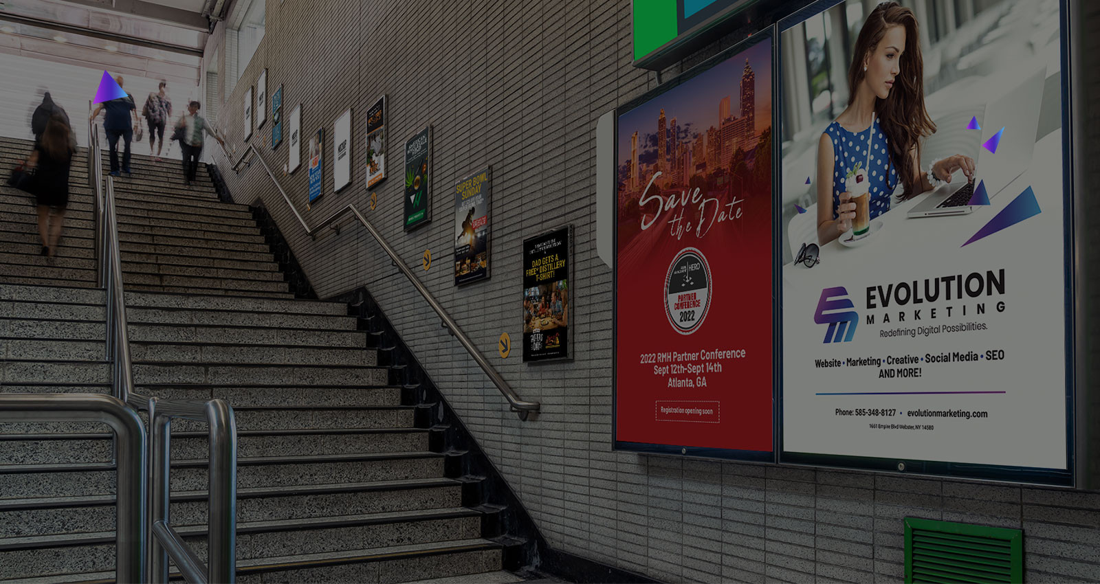 People walking up stairs in a subway with posters and advertisements on the tiled wall.