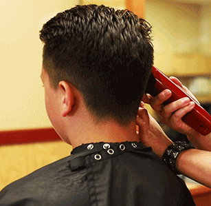 animated gif of a man getting his hair cut