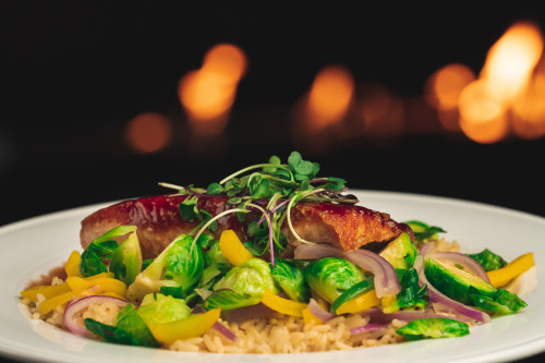 salmon over a bed of vegetables