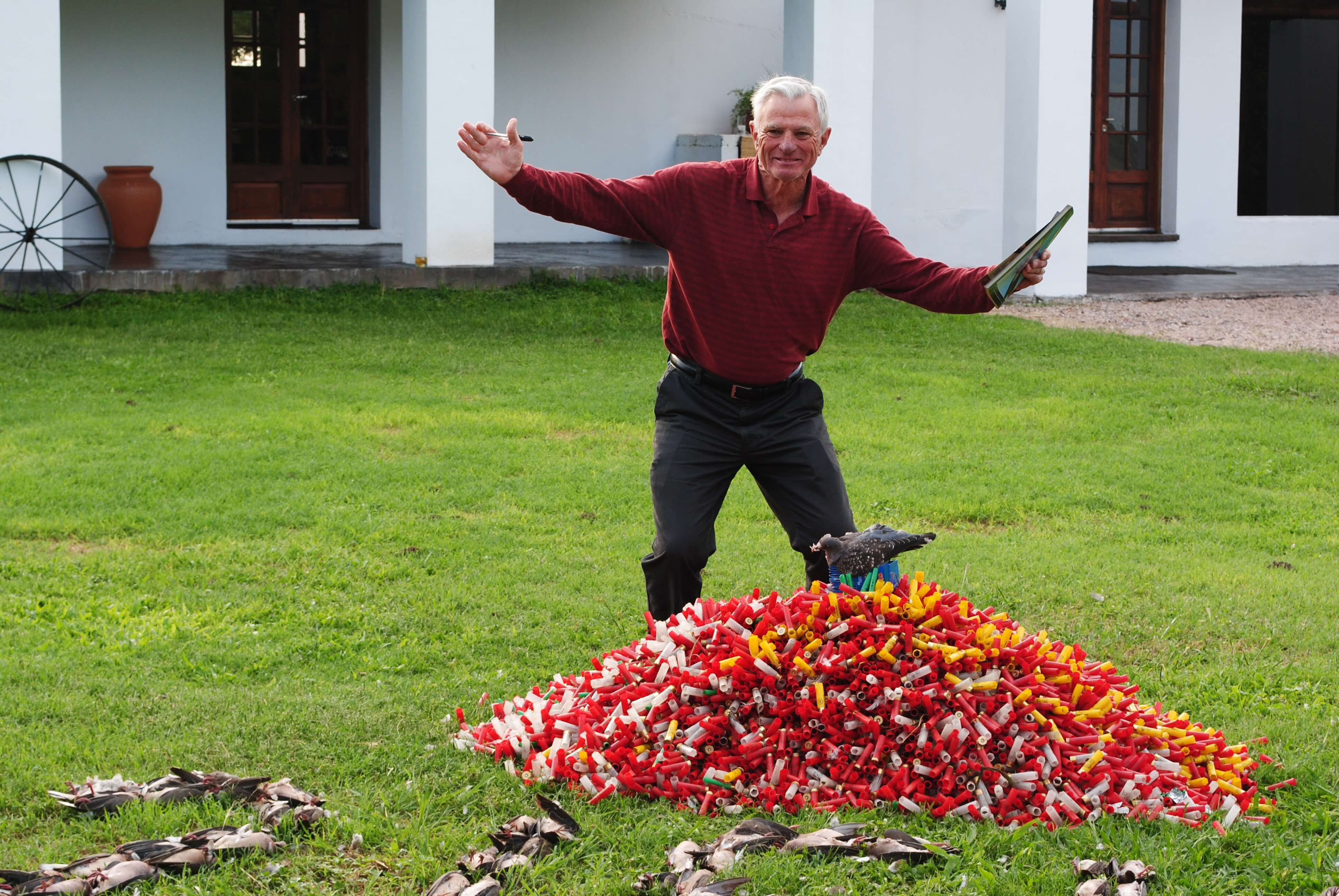 man with trophy birds
