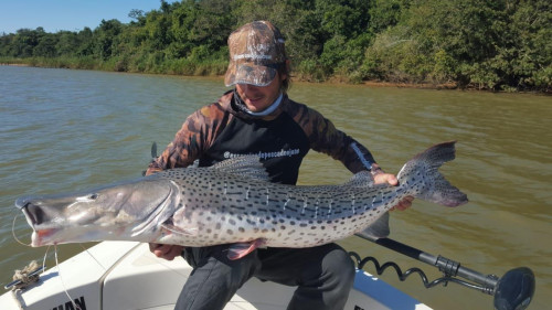 fisherman posing with large fish