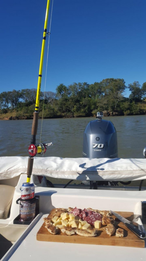 fishing pole leaning on boat