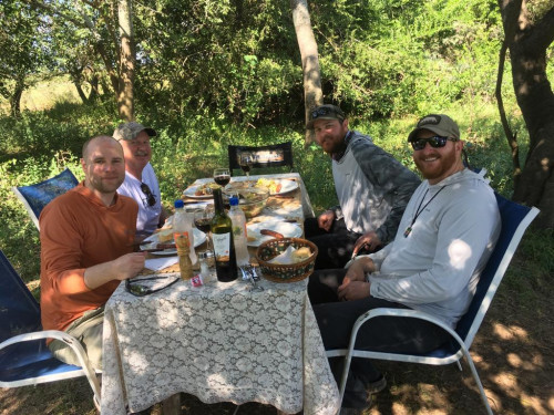 four people sharing meal