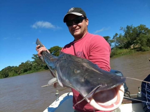 man with trophy fish