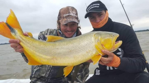 two people with trophy fish