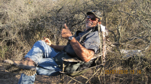 hunter sitting in a field
