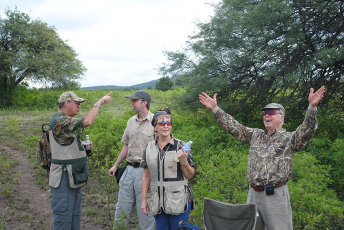 3 men 1 woman posing in argentina hunt